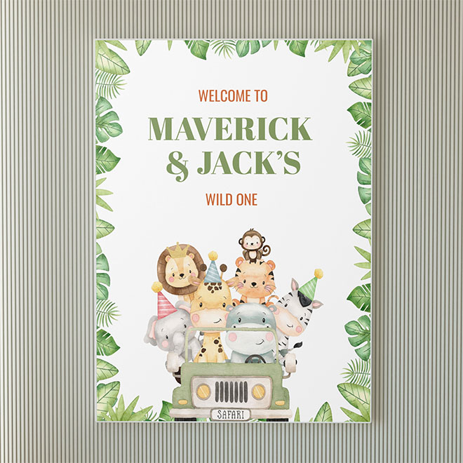 Safari-themed first birthday sign with jungle animals and “Wild One” text for Maverick and Jack