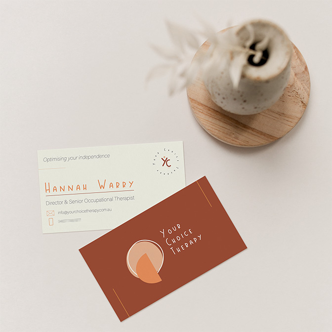Modern therapy business cards for Your Choice Therapy styled on light background with ceramic vase