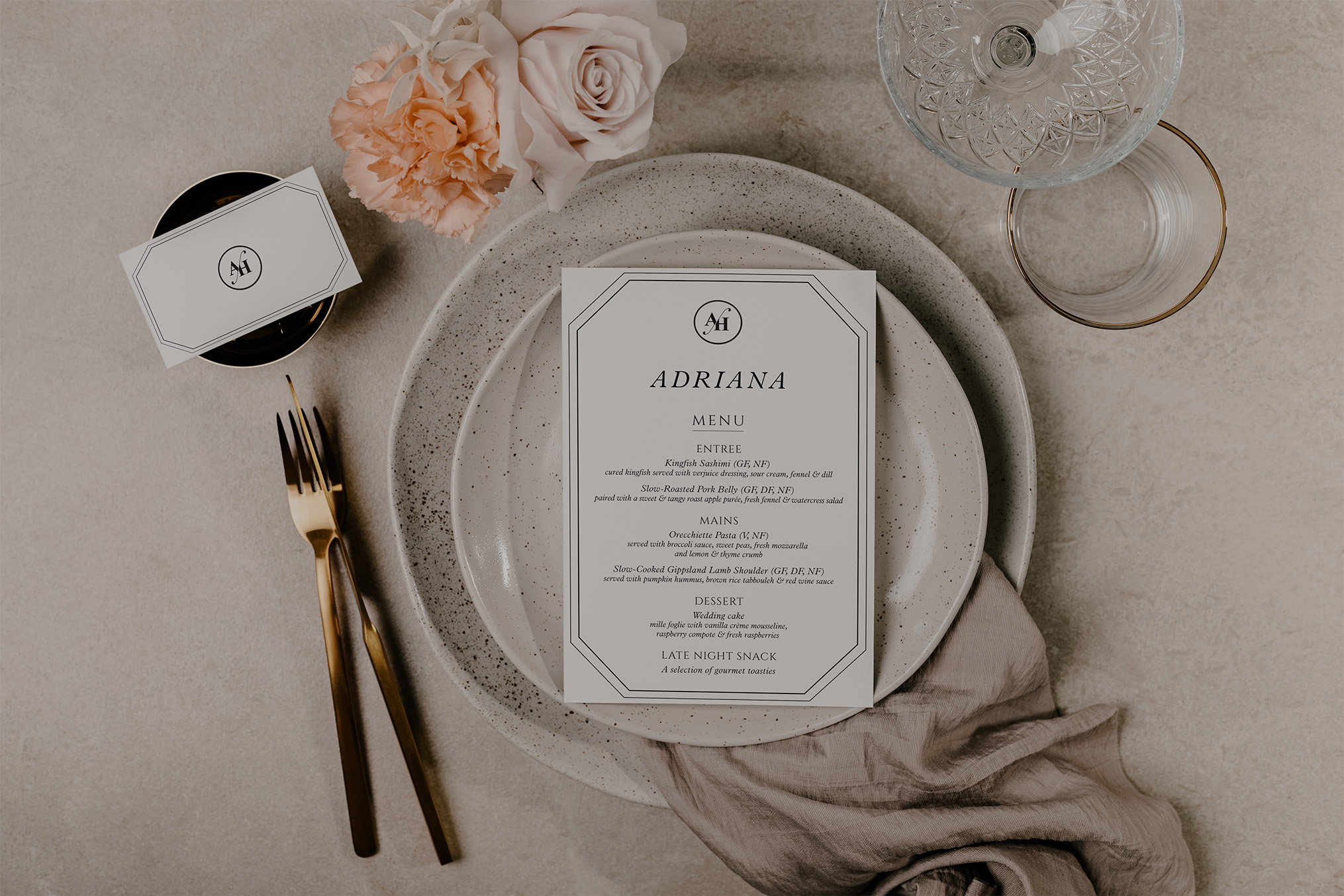 Wedding table place setting with modern menu and monogram place card designed by Tina Jenner Designs.