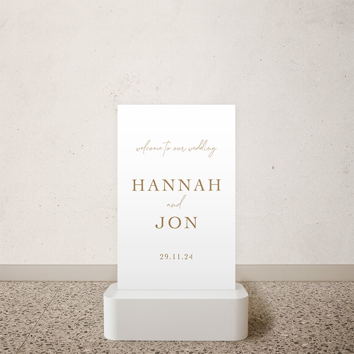Minimalist white wedding welcome sign with gold text for Hannah and Jon, dated 29.11.24
