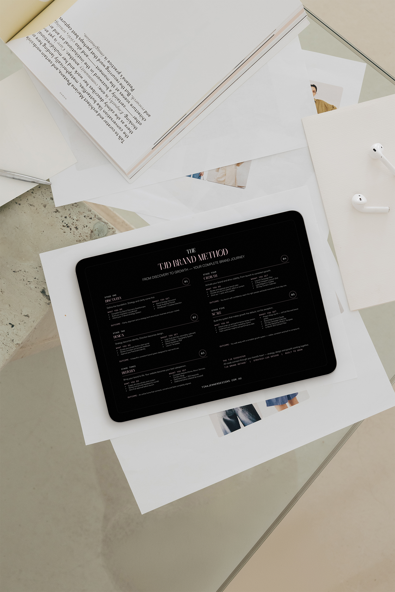 Tina Jenner Designs brand method displayed on tablet showing five-stage discovery to growth process, styled with design materials and samples on white background.