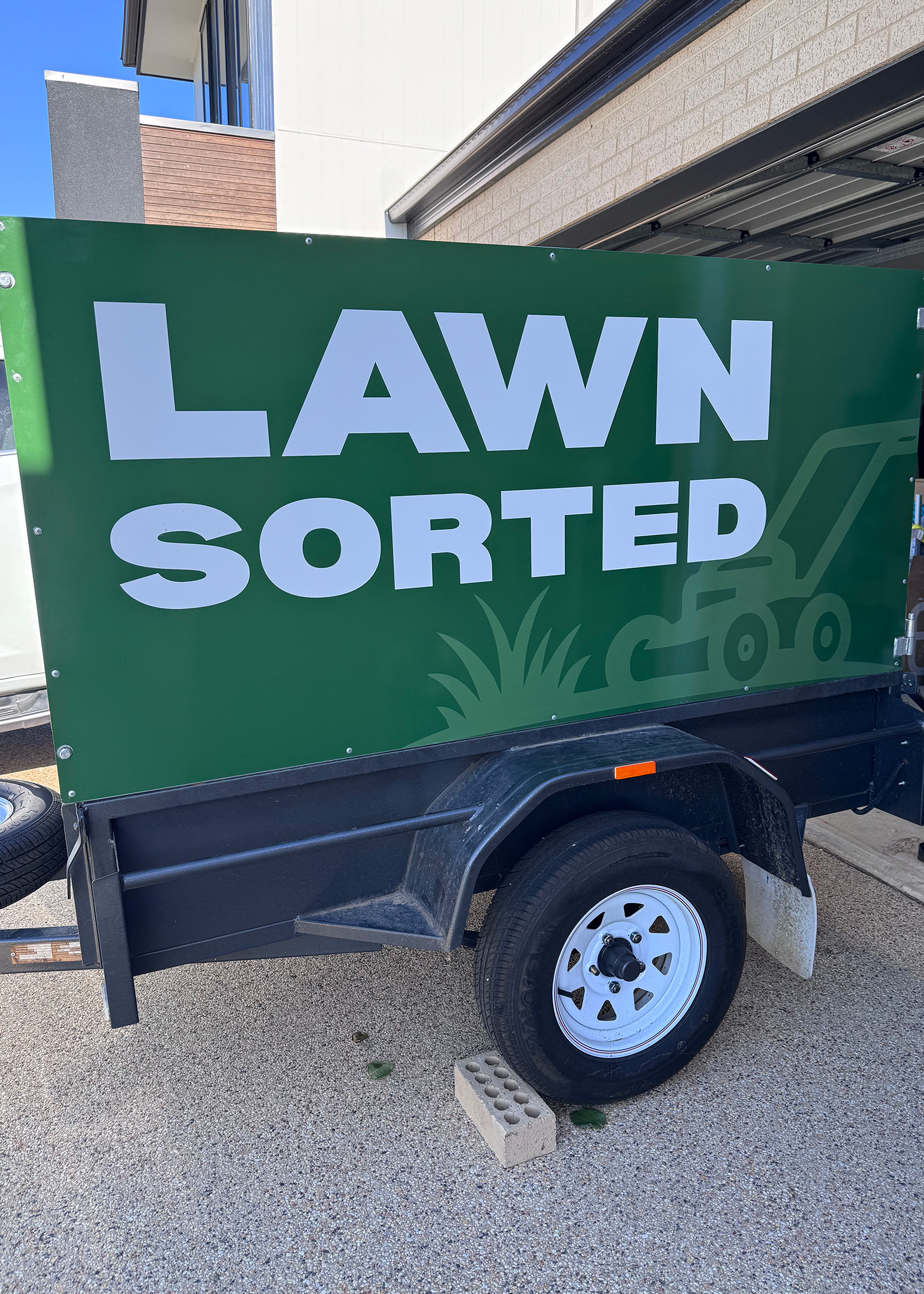 Lawn Sorted branded trailers and mobile signage displaying company name and logo on job sites across Greater Geelong